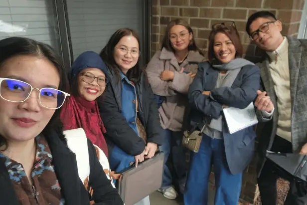 Filipino nurses in group photo and pediatric training for USRN jobs with visa sponsorship through Towne Kids