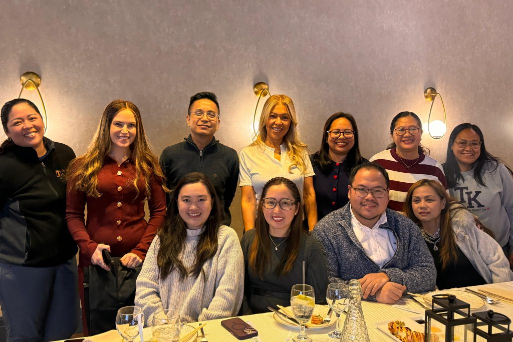 Filipino nurses and Towne Kids organizers gathered around a dinner table in Lakewood, New Jersey.