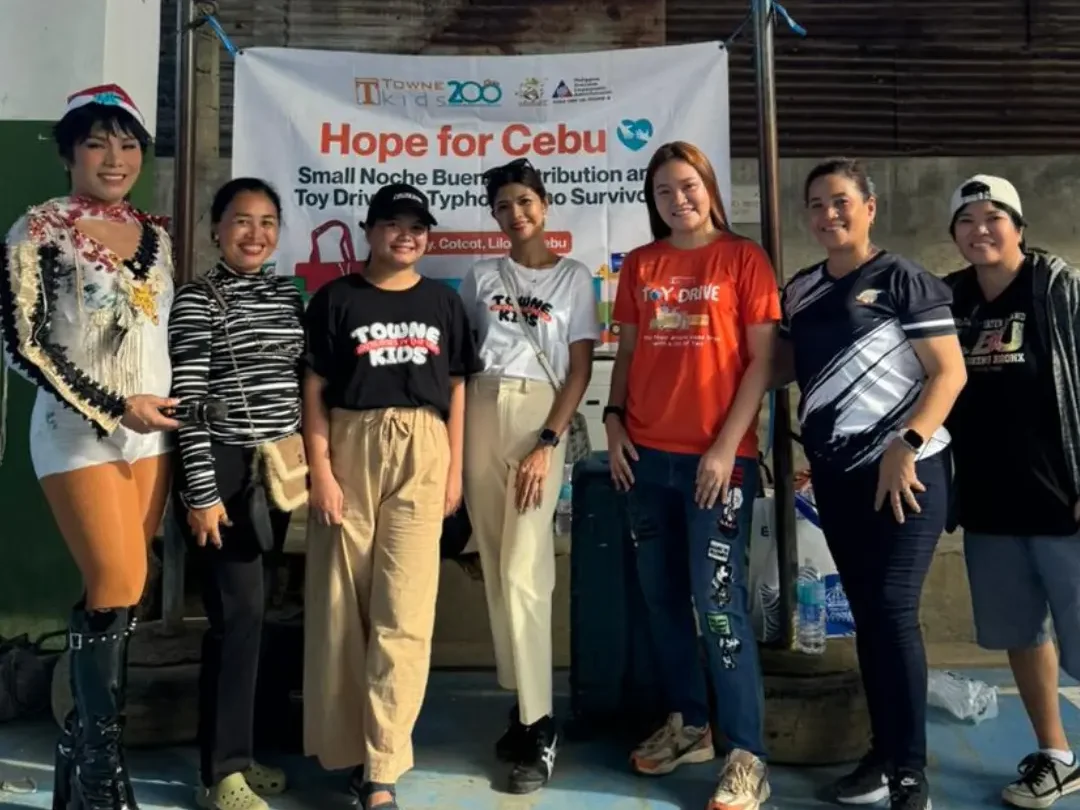 Towne Kids Toy Drive volunteers in Cebu standing in front of Hope for Cebu banner