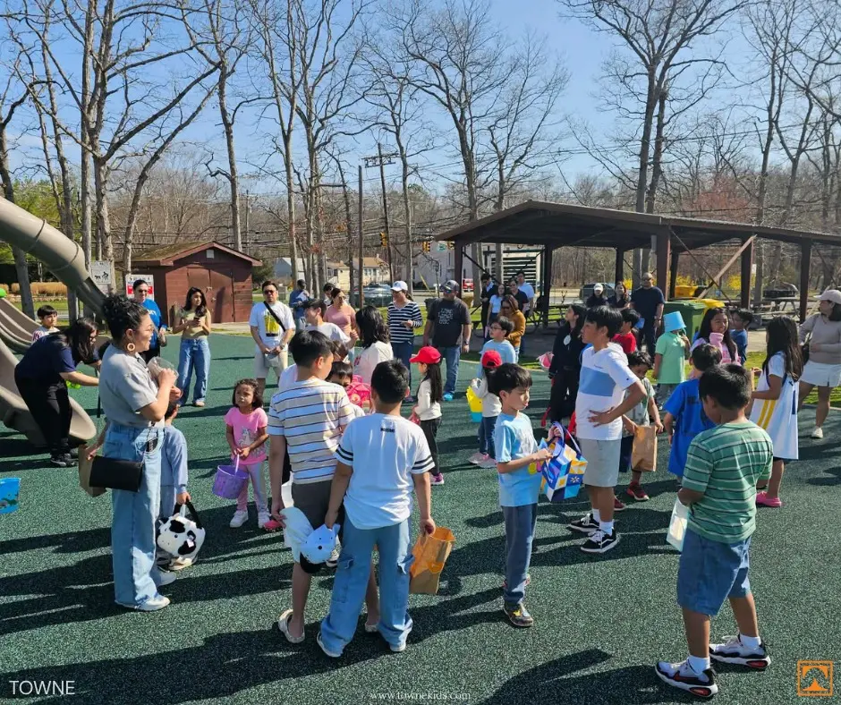 Families and children gathering at a playground during Towne Kids Easter event celebrating nurses and their families